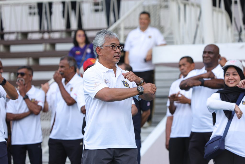 Their Majesties leading the walk at Stadium Merdeka